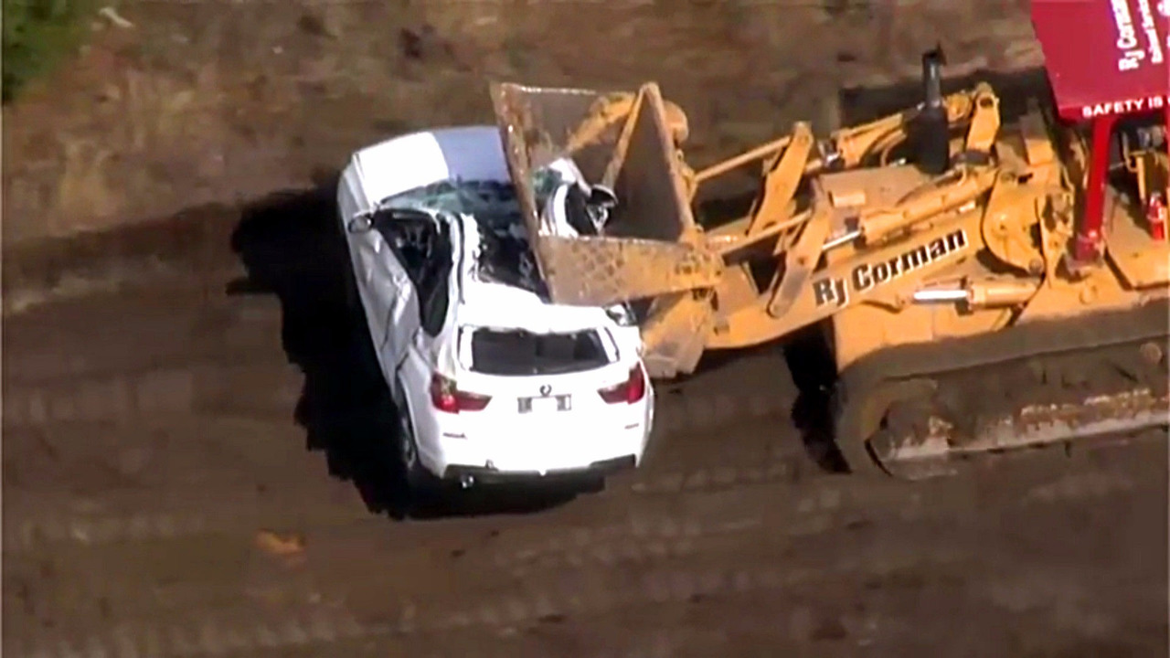 BMWs wrecked in train crash